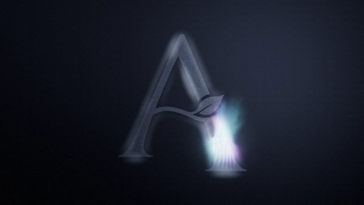 Dark glass with iridescent currents swirling through the shape of the Appel A.